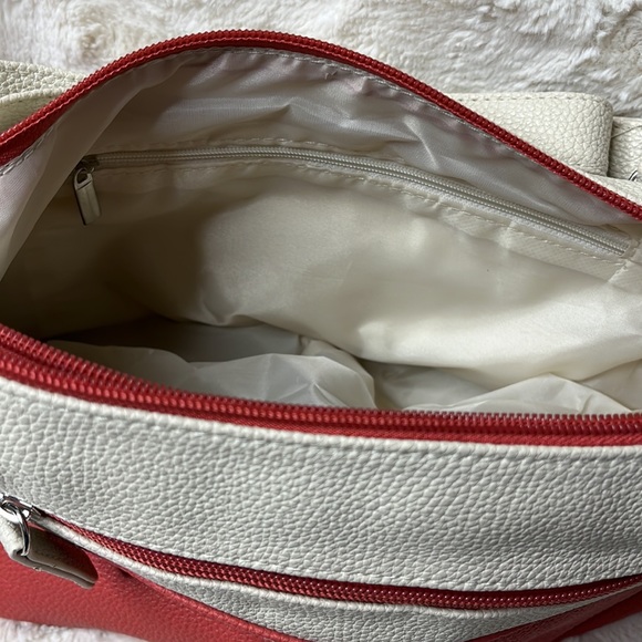 Stone & Co. two-toned crossbody. Double zipper top closure. Adjustable strap - Picture 12 of 15